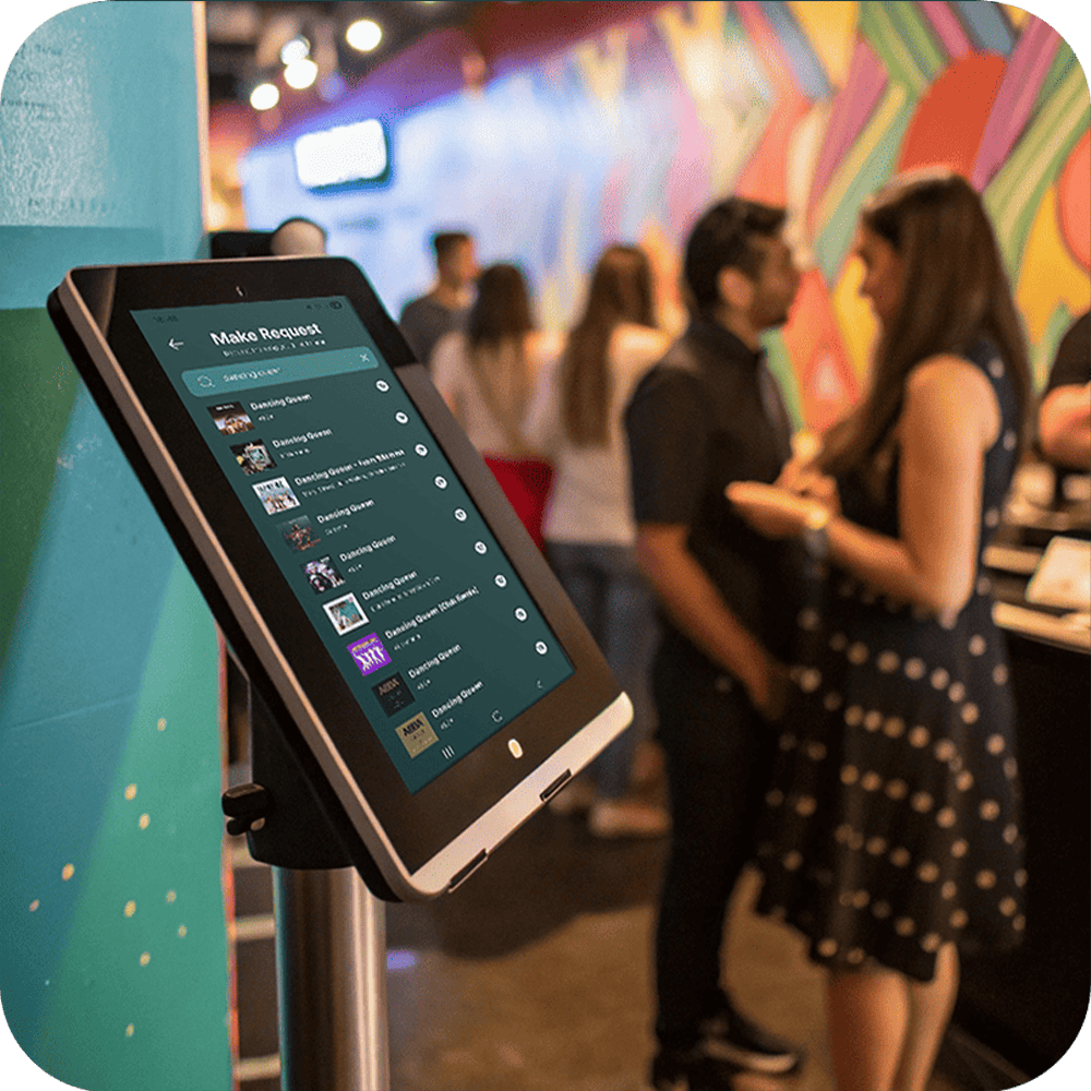 A tablet running Rekwest in kiosk mode at a karaoke venue for singers to request songs